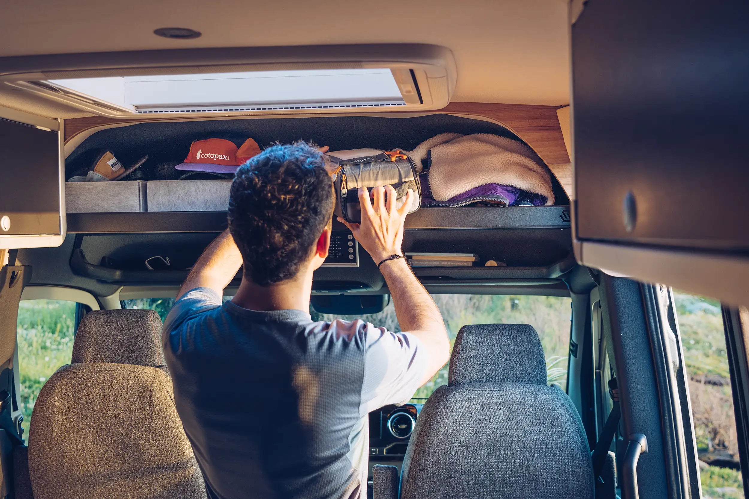 Overhead shelf storage above driver and passenger seats